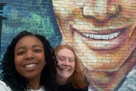 Makeda Grimaud, left, and Natalie Sheridan in front of Nat King Cole mural.