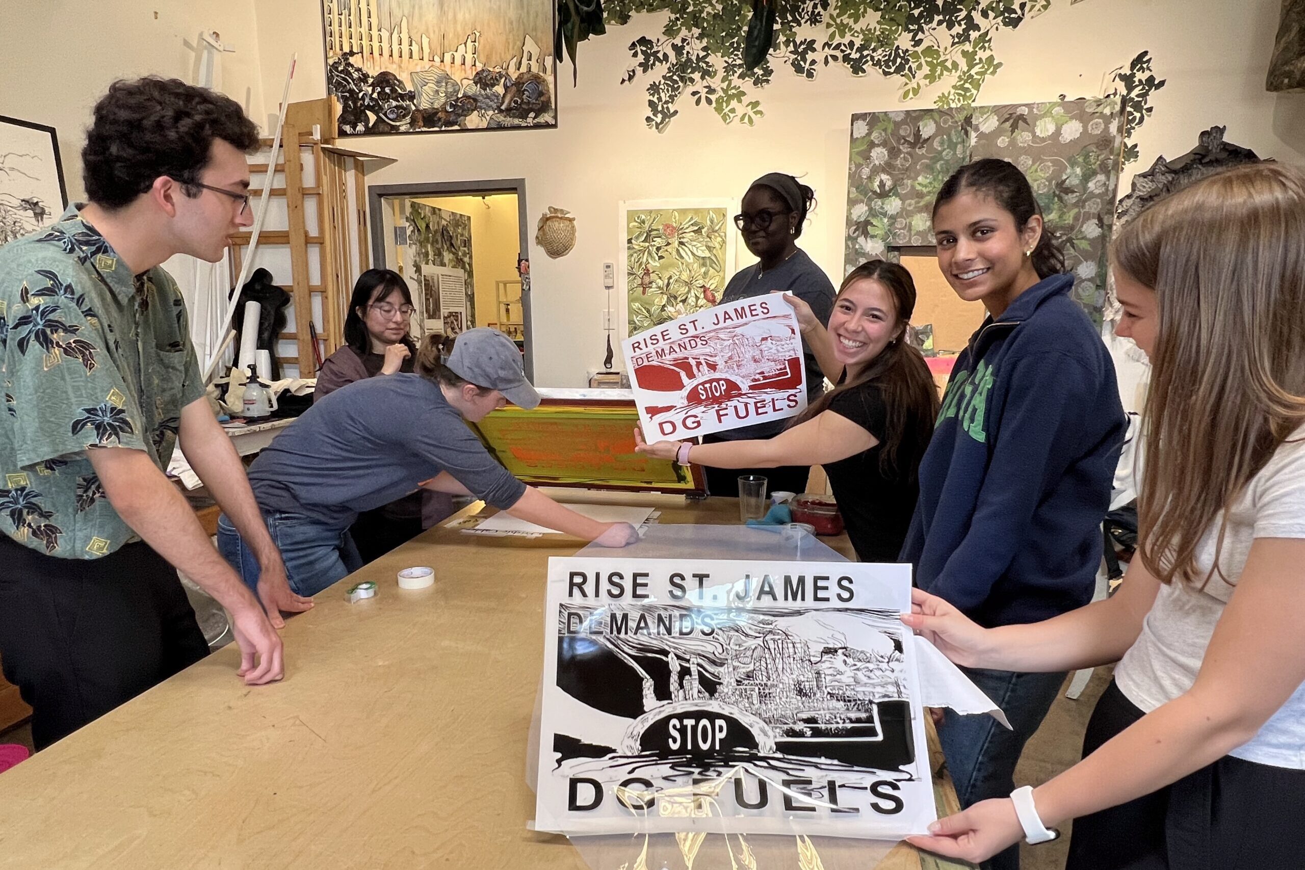 Students on the Cancer Alley trip make prints for the faith-based grassroots organization Rise St. James