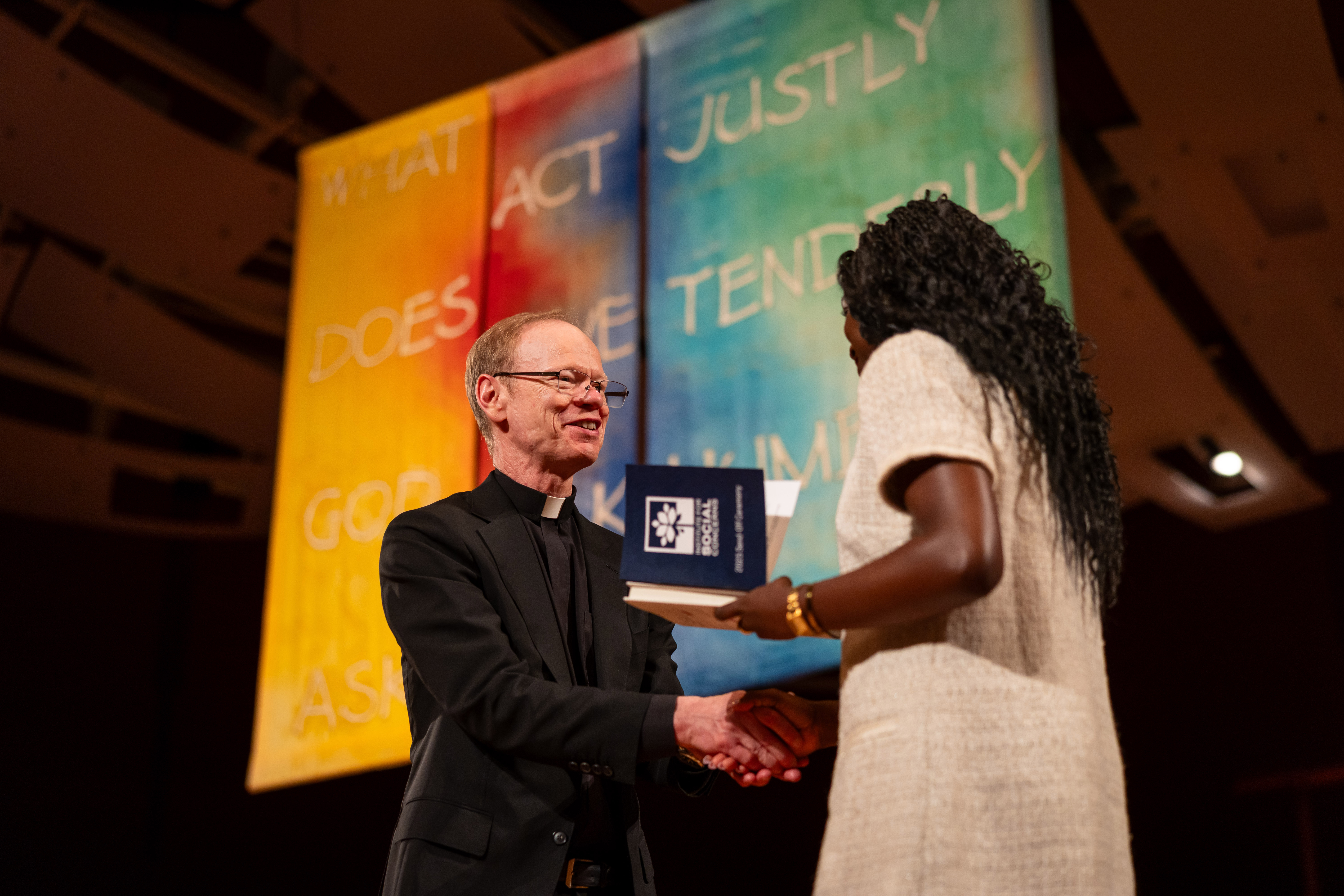 May 16, 2025; University of Notre Dame President Robert A. Dowd, C.S.C. shakes hands with graduates during the Institute for Social Concerns Senior Send-off at the DeBartolo Performing Arts Center. (Photo by Michael Caterina/University of Notre Dame)